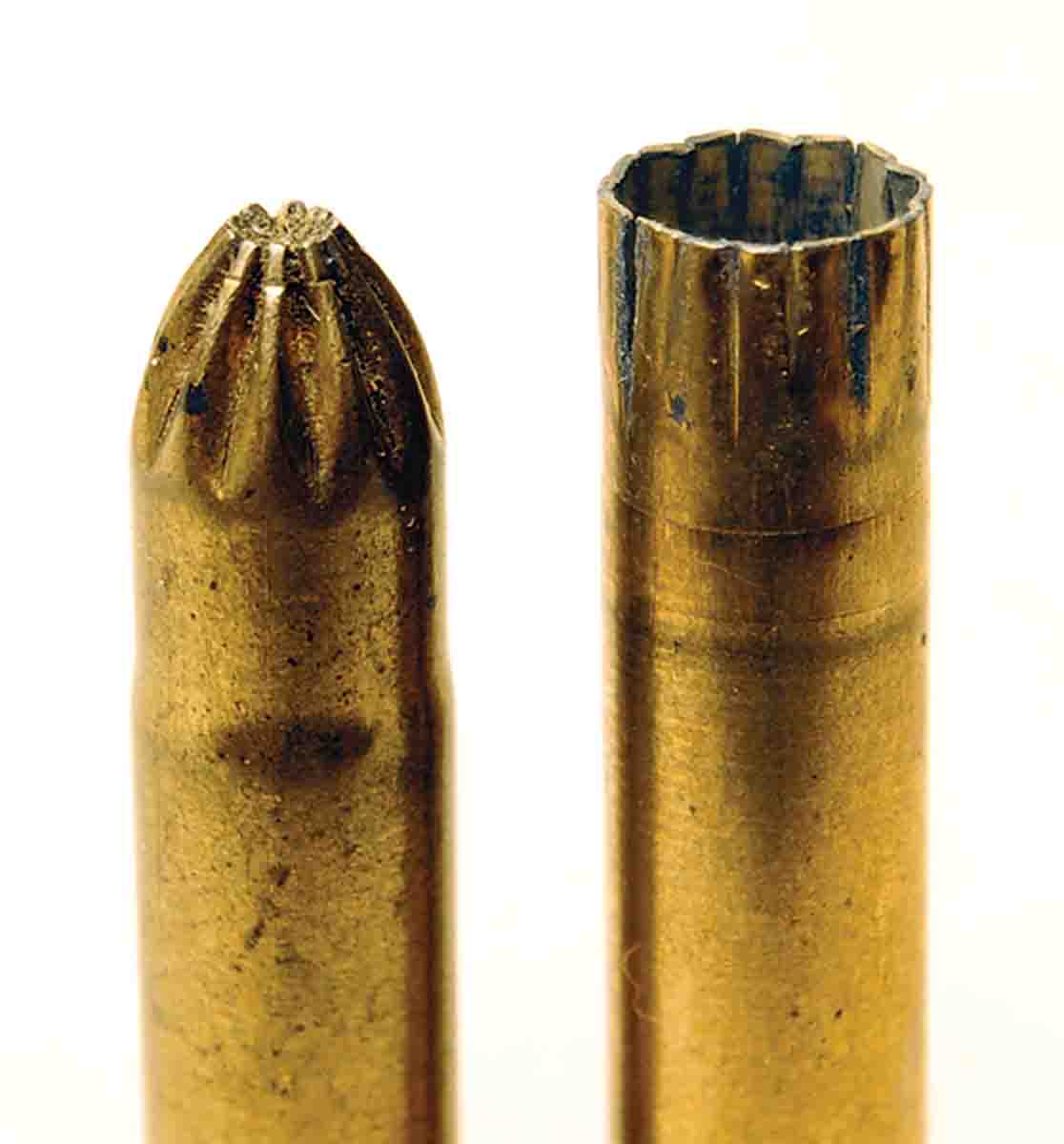 A close-up of a modern rose crimp and a fired shot cartridge, which shows that the crimp does open fully to release shot.